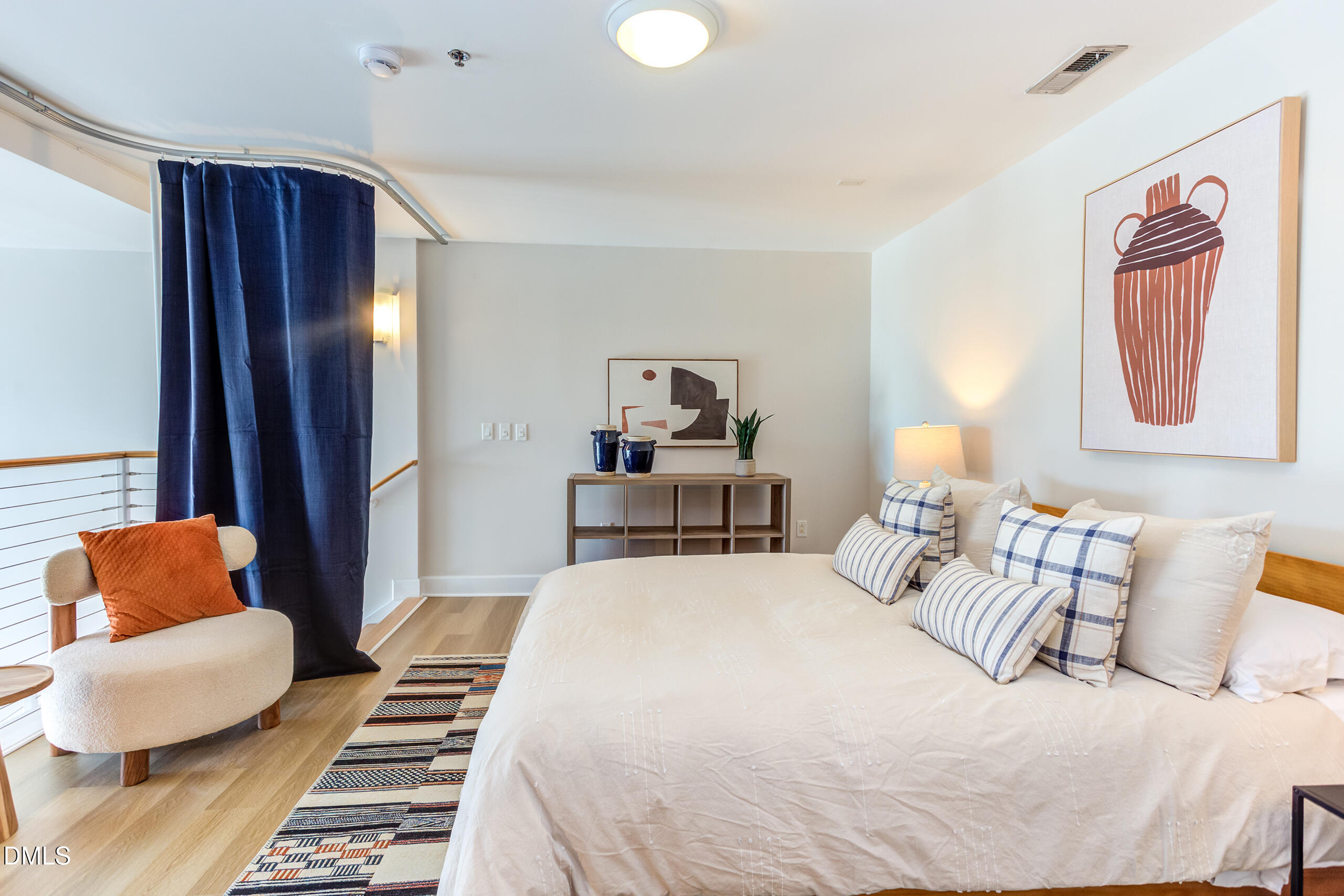 2608 Erwin Road, Unit 417 Durham, NC 27705 - Photo 33 of 50 a bedroom with furniture and a large mirror