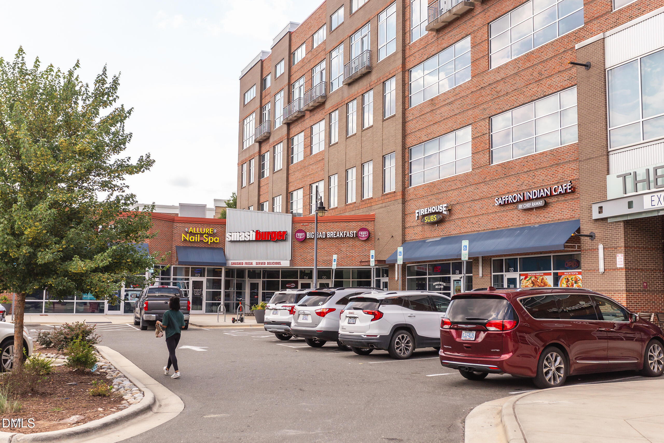 2608 Erwin Road, Unit 417 Durham, NC 27705 - Photo 49 of 50 a city street lined with parked cars and buildings