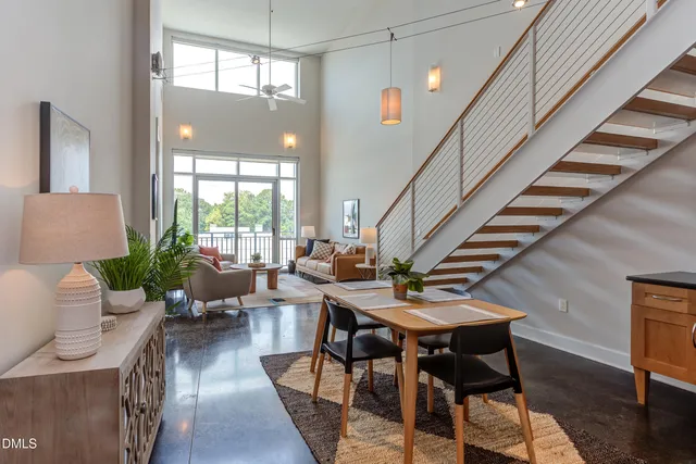 a kitchen with stainless steel appliances granite countertop a stove a sink dishwasher a refrigerator and cabinets with wooden floor