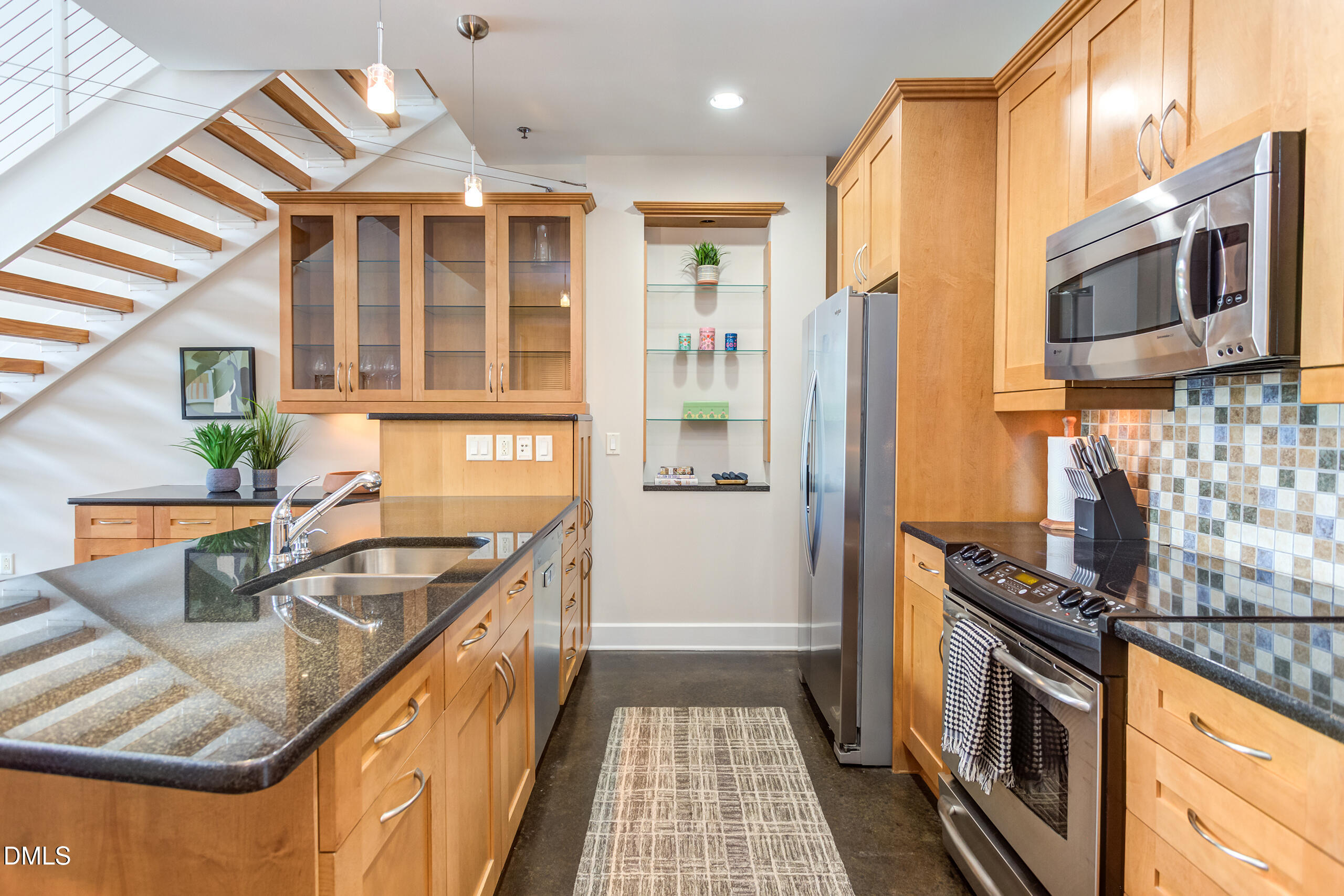 2608 Erwin Road, Unit 417 Durham, NC 27705 - Photo 7 of 50 a kitchen with stainless steel appliances granite countertop a sink stove and refrigerator