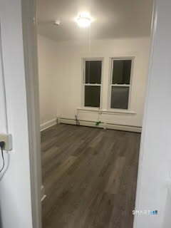 79 Chestnut Street Winchester, CT 06098 - Photo 7 of 10 a view of wooden floor and windows in a room