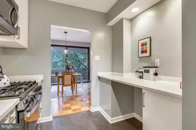 a kitchen with a sink and a stove top oven