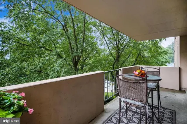 a balcony view with couple of chairs