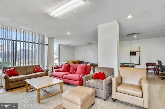 a view of a backyard with floor to ceiling windows