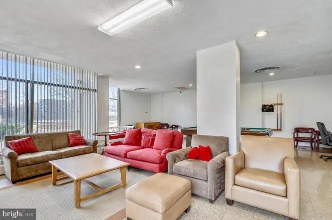4141 North Henderson Road, Unit 322 Arlington, VA 22203 - Photo 42 of 53 a living room with furniture and a couch