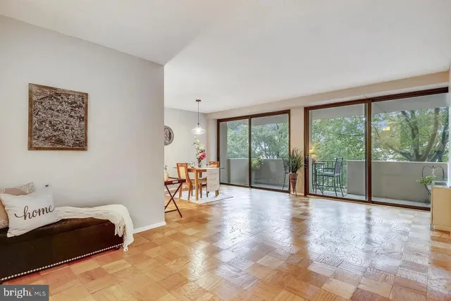 a view of a room with furniture and a large window