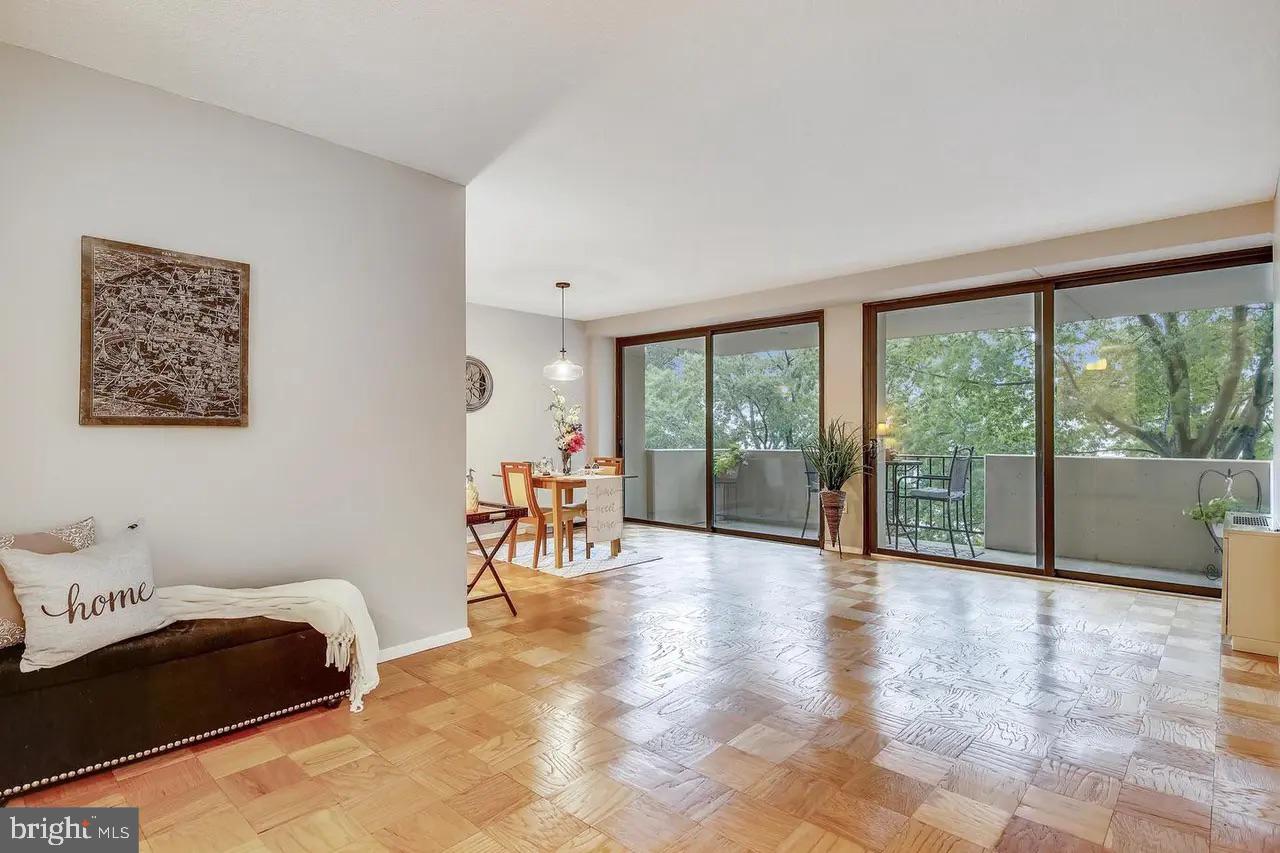4141 North Henderson Road, Unit 322 Arlington, VA 22203 - Photo 6 of 53 a view of a room with furniture and a large window