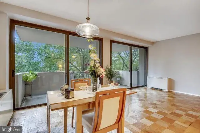 a room with patio furniture and windows