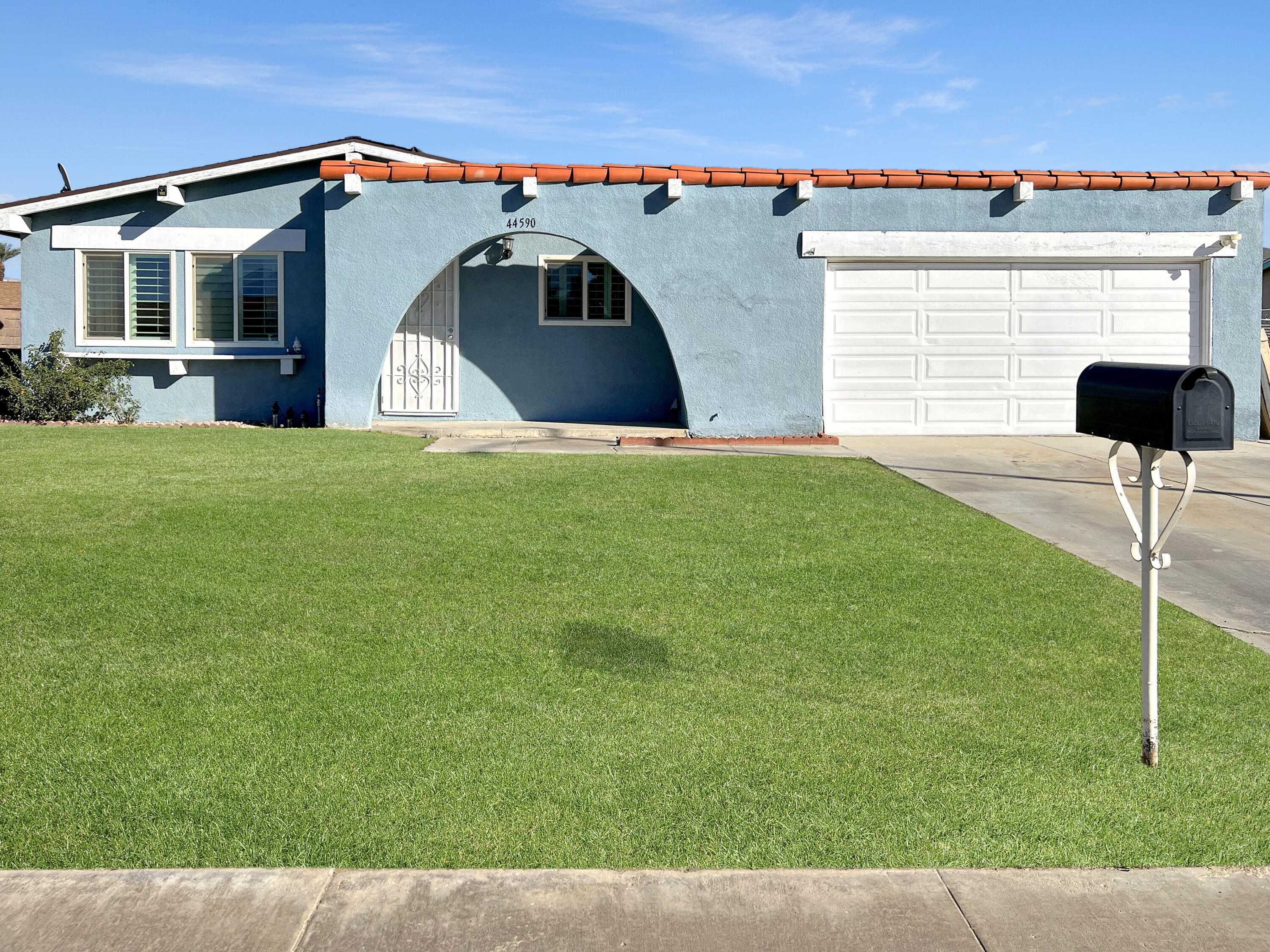 44590 Roundtable Street Indio, CA 92201 - Photo 2 of 16 a front view of a house with a yard