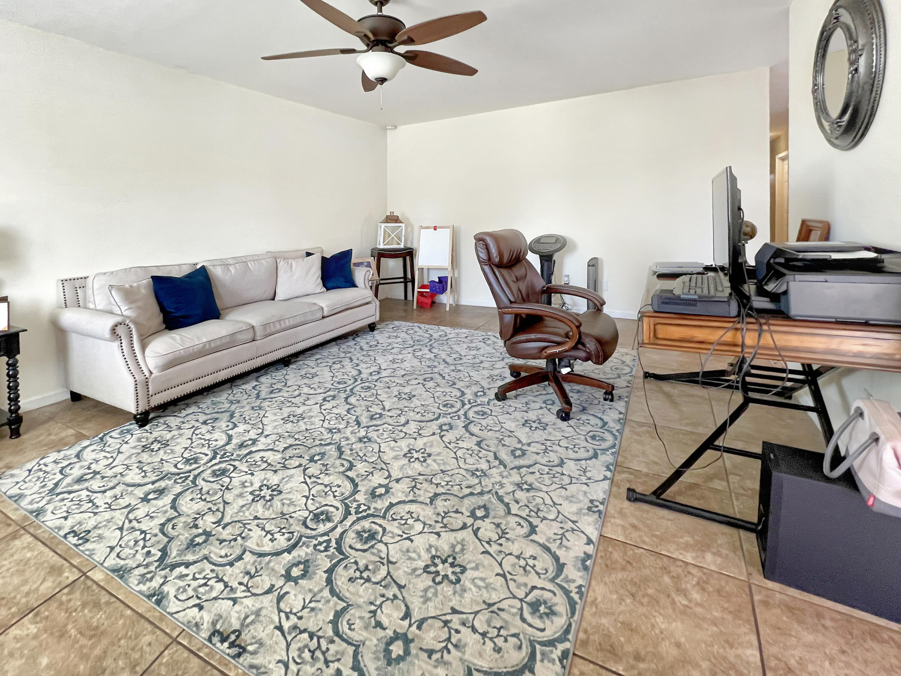 44590 Roundtable Street Indio, CA 92201 - Photo 3 of 16 a living room with furniture and a rug