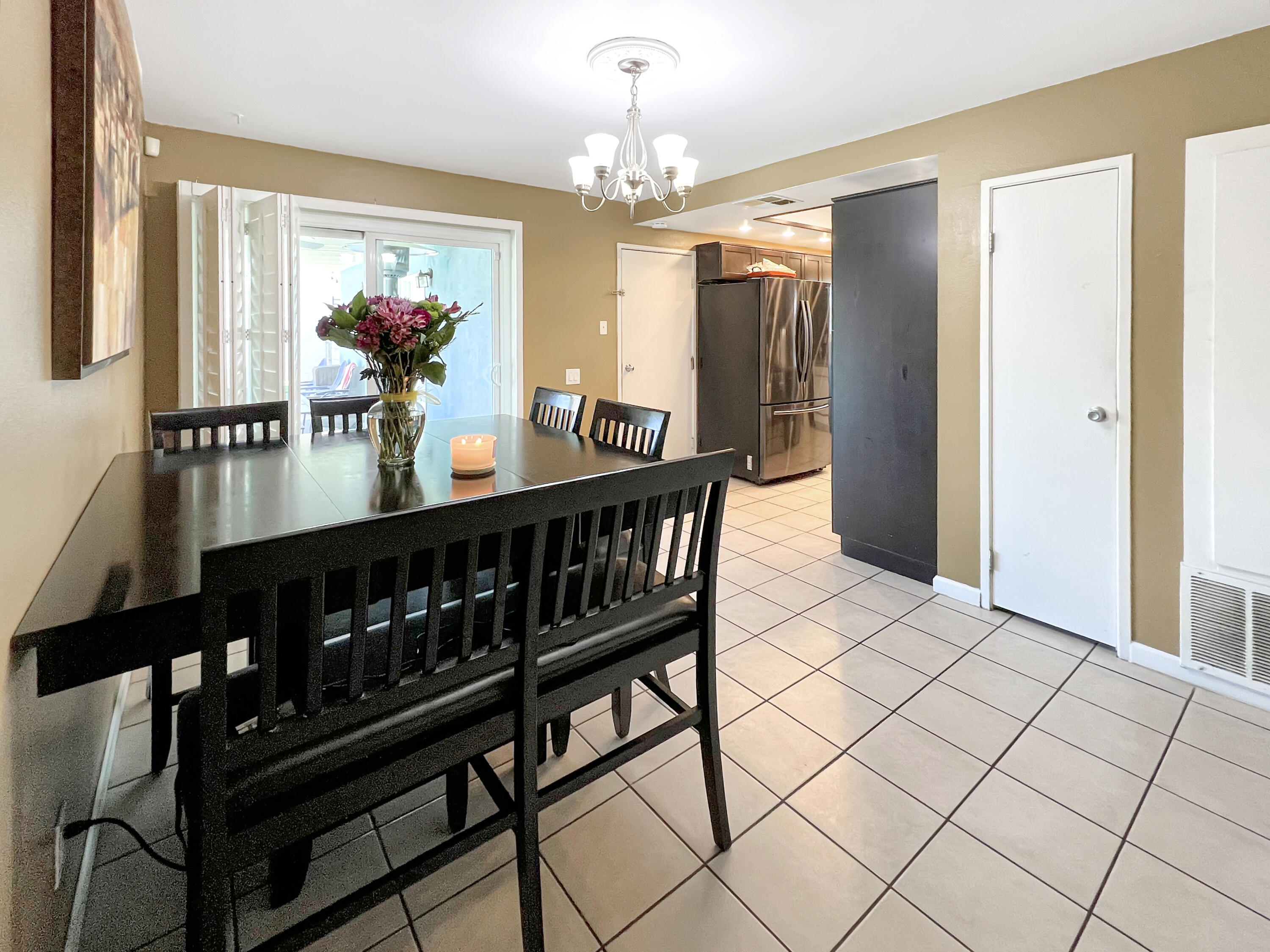 44590 Roundtable Street Indio, CA 92201 - Photo 5 of 16 a view of a dining room with furniture and chandelier