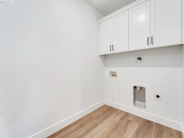 a view of cabinets a sink and dishwasher in a white cabinet