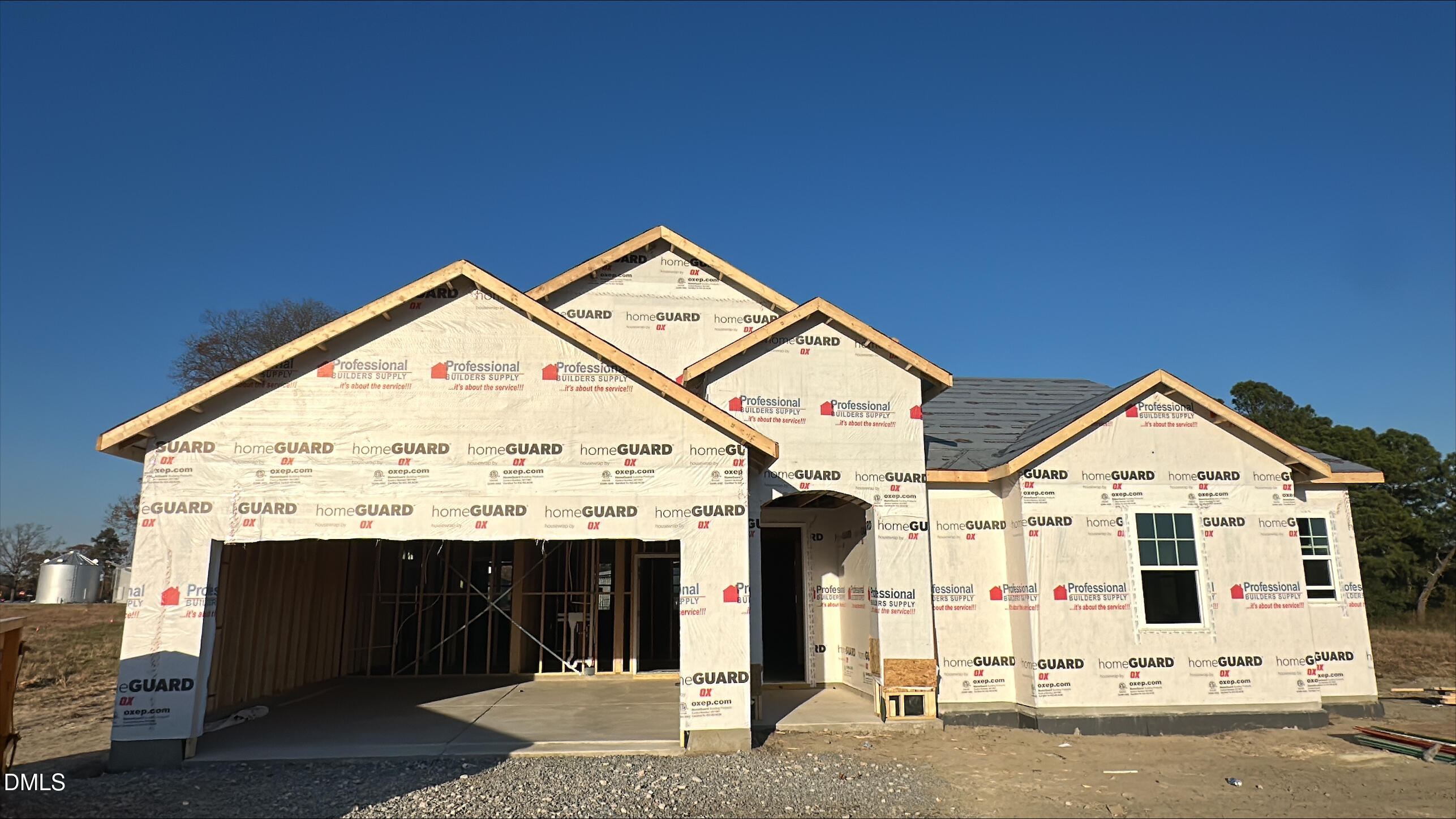 a view of a house with wooden fence