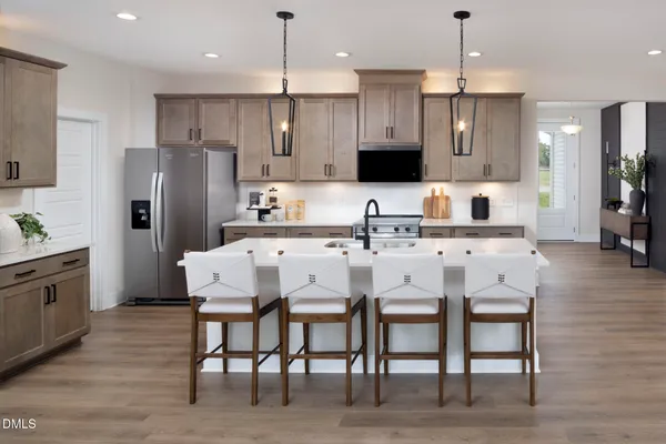 a front view of a house with outdoor seating