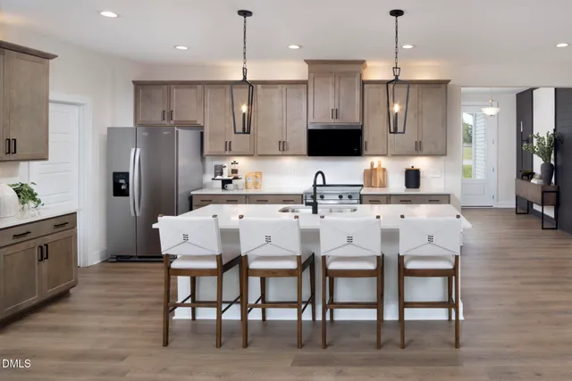 a front view of a house with outdoor seating