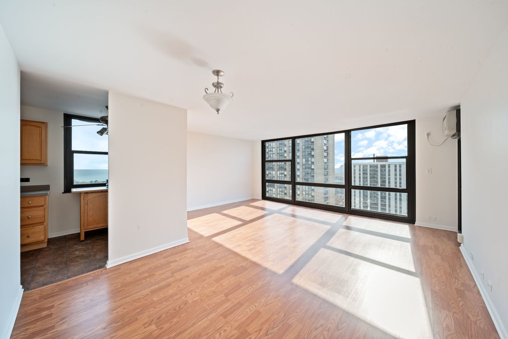 2605 South Indiana Avenue, Unit 2107 Chicago, IL 60616 - Photo 11 of 24 a view of a room with a large window
