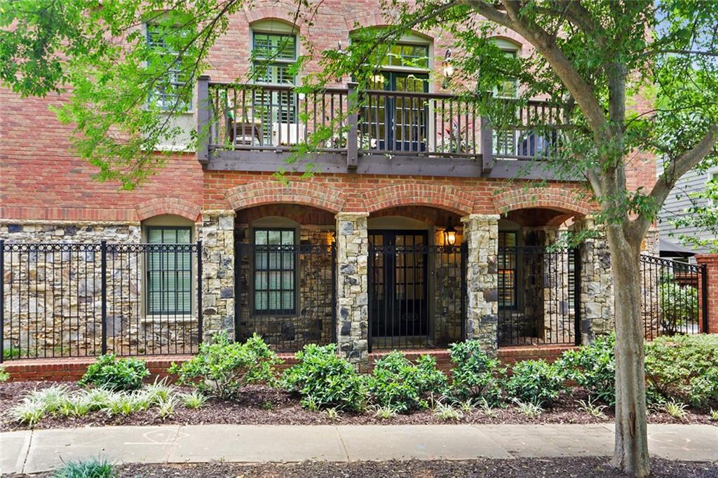 1574 Spring Street Southeast Smyrna, GA 30080 - Photo 1 of 1 This home that is featuring an all brick facade holds an incredible balcony, perfect for a morning coffee and enjoying the suns rays.