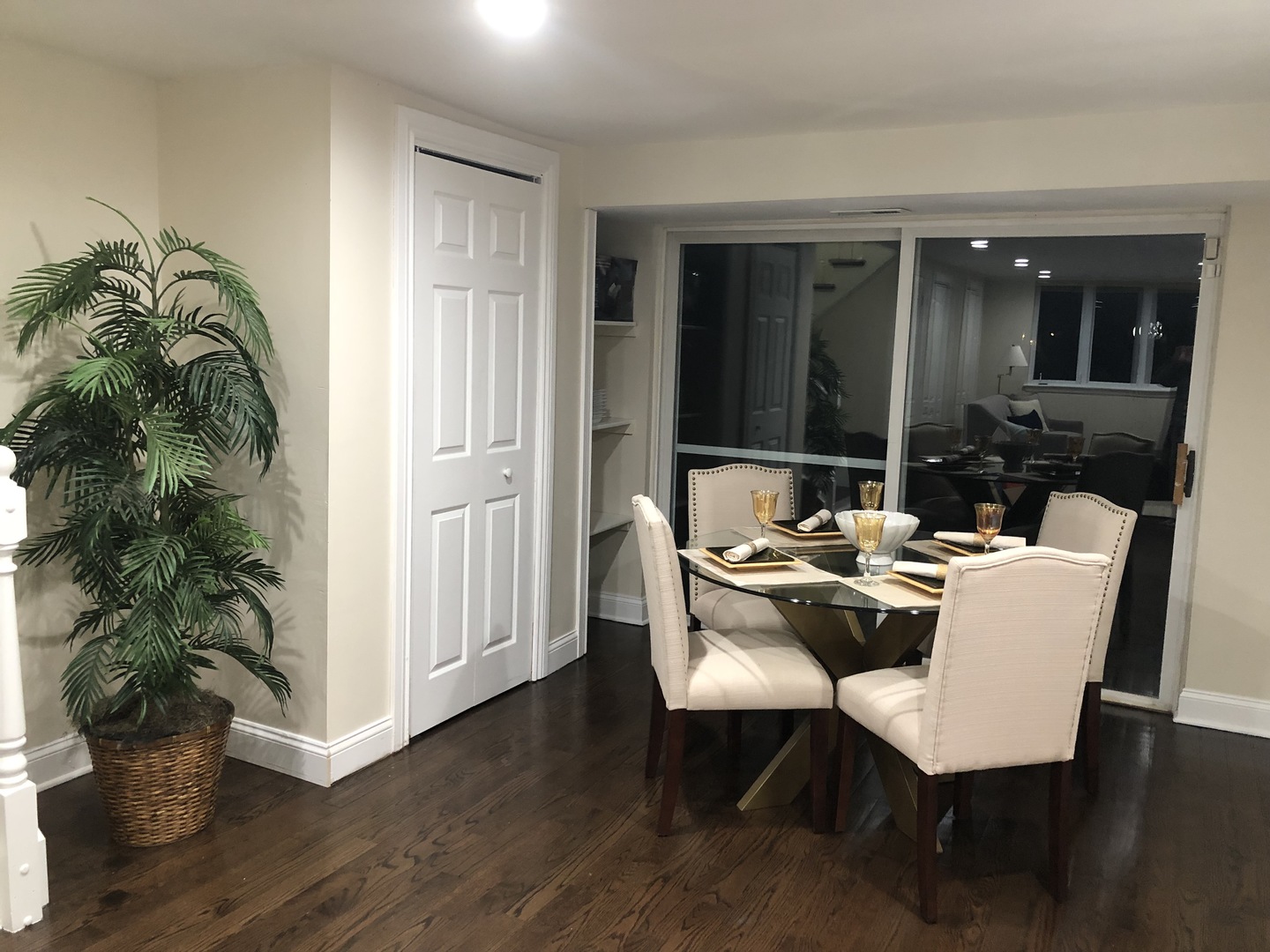 2933 Central Road Glenview, IL 60025 - Photo 24 of 38 a living room with furniture a potted plant and a wooden floor