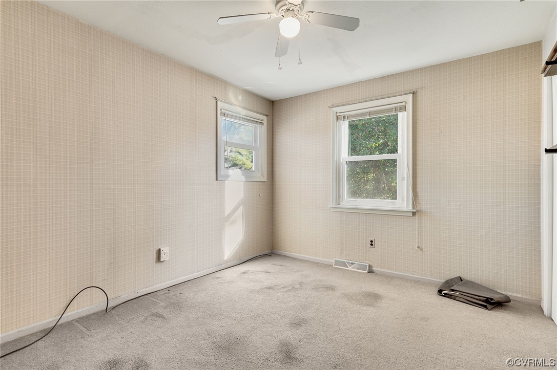 9510 Riddle Road Chesterfield, VA 23832 - Photo 11 of 20 an empty room with windows and ceiling fan