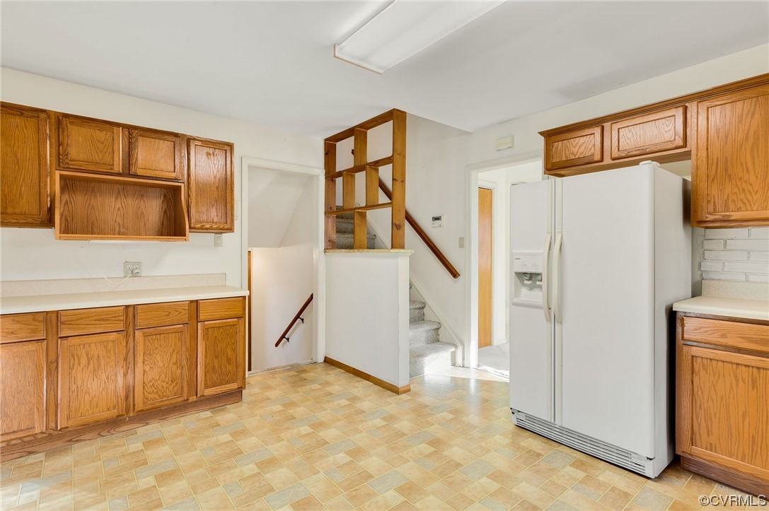 9510 Riddle Road Chesterfield, VA 23832 - Photo 6 of 20 a view of entryway with kitchen cabinets and a refrigerator