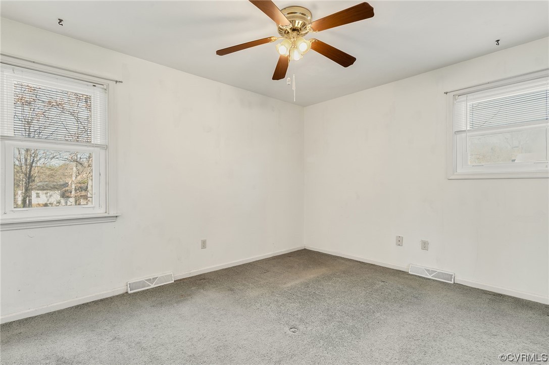 9510 Riddle Road Chesterfield, VA 23832 - Photo 9 of 20 an empty room with a window and a fan