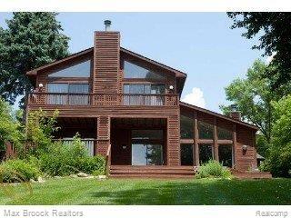 9645 Norman Road Clarkston, MI 48348 - Photo 1 of 16 View of house from lake