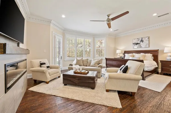 a living room with furniture fireplace and a flat screen tv