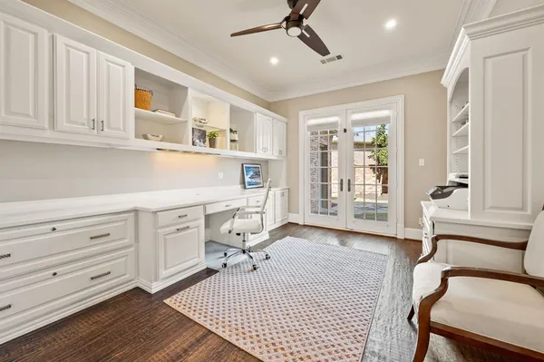 a workspace with wooden floor and furniture