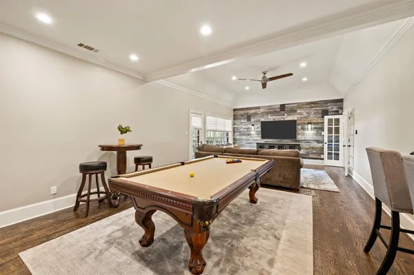 a room with furniture and pool table