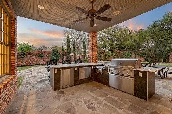 a open kitchen with stainless steel appliances granite countertop a stove a sink and a refrigerator