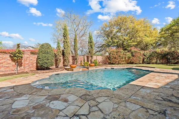 a view of a park with large trees