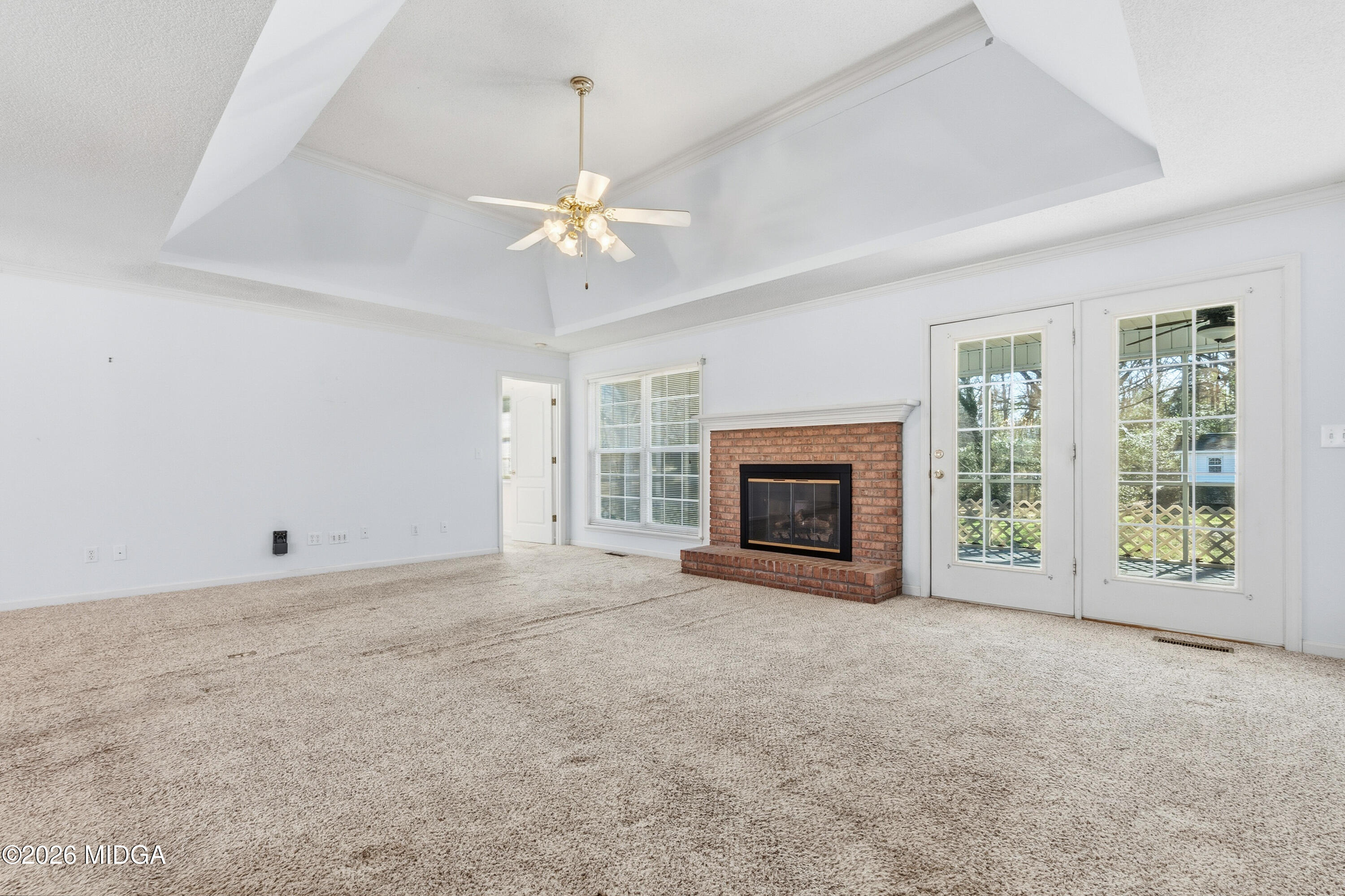 8278 Lower Thomaston Road Macon, GA 31220 - Photo 12 of 59 an empty room with windows and fireplace
