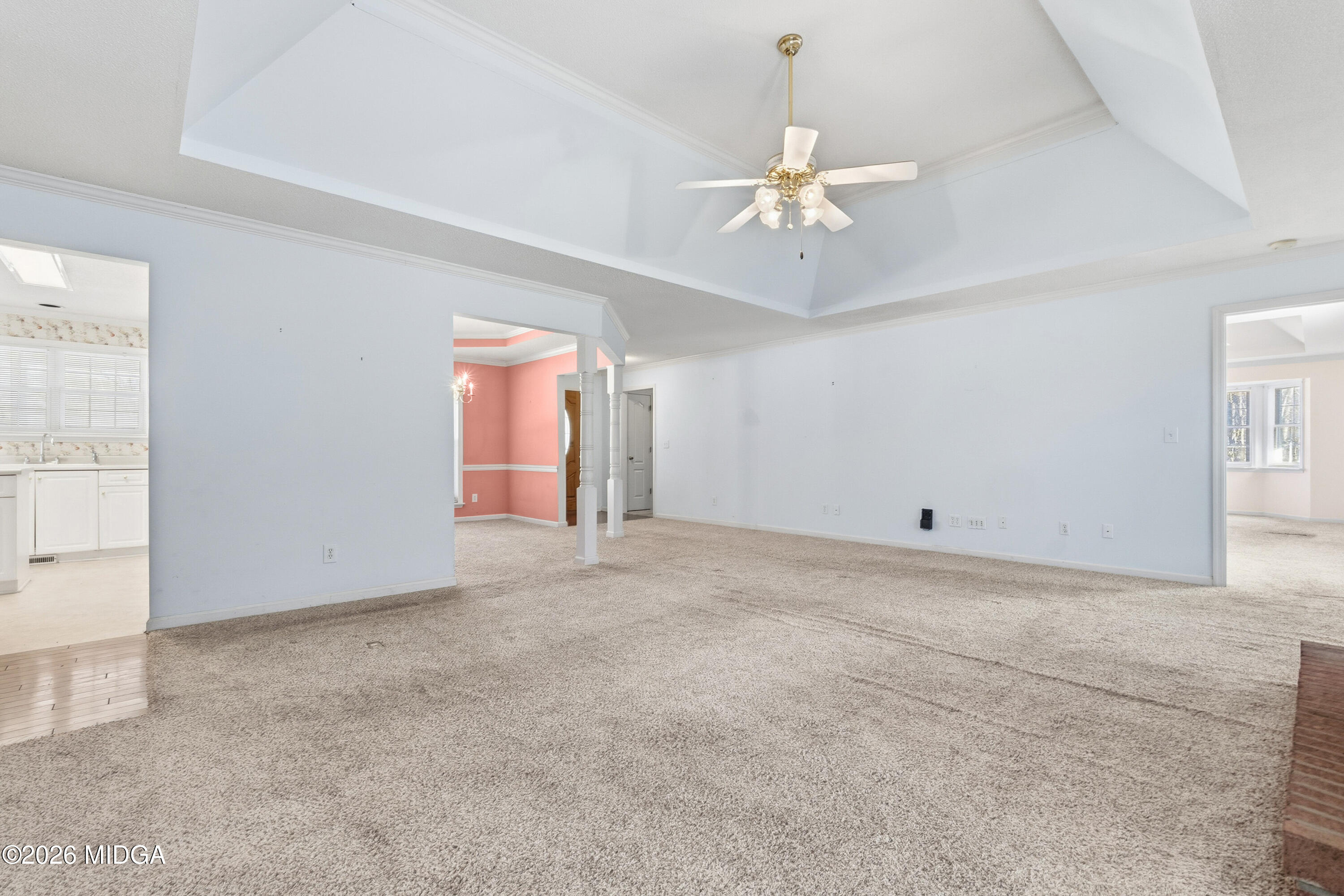 8278 Lower Thomaston Road Macon, GA 31220 - Photo 13 of 59 an empty room with chandelier fan and windows