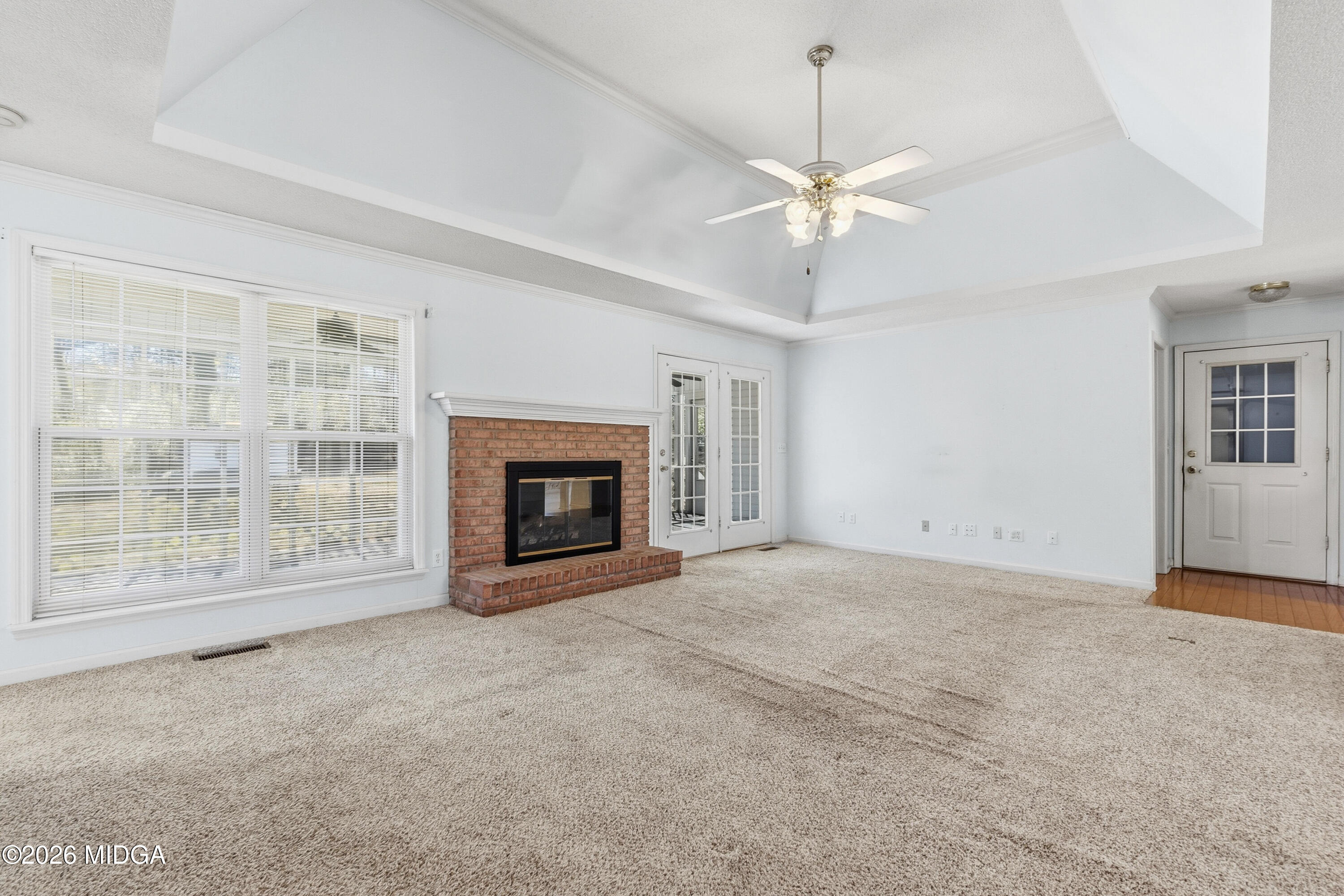 8278 Lower Thomaston Road Macon, GA 31220 - Photo 15 of 59 a view of empty room with a fireplace and fan