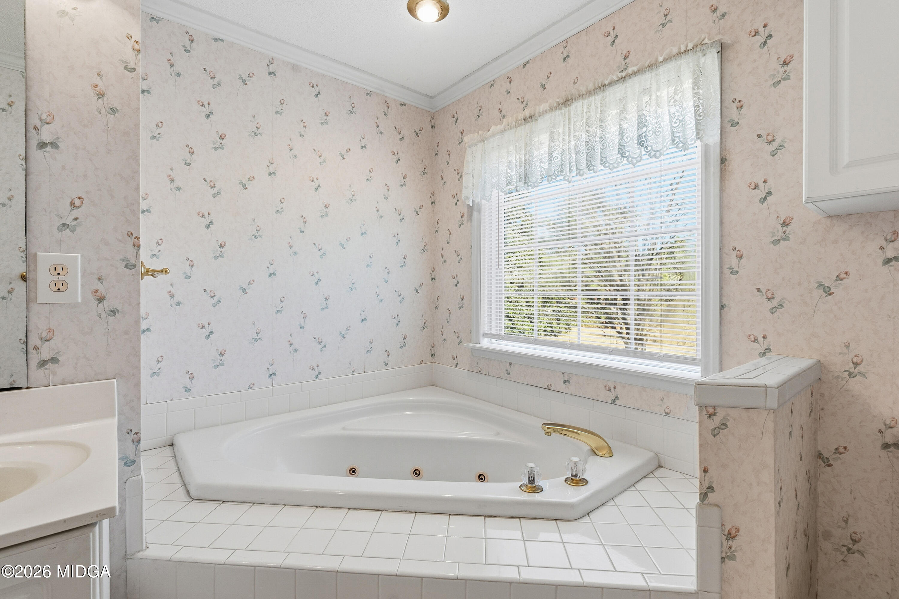 8278 Lower Thomaston Road Macon, GA 31220 - Photo 25 of 59 a bathroom with a bathtub and a shower