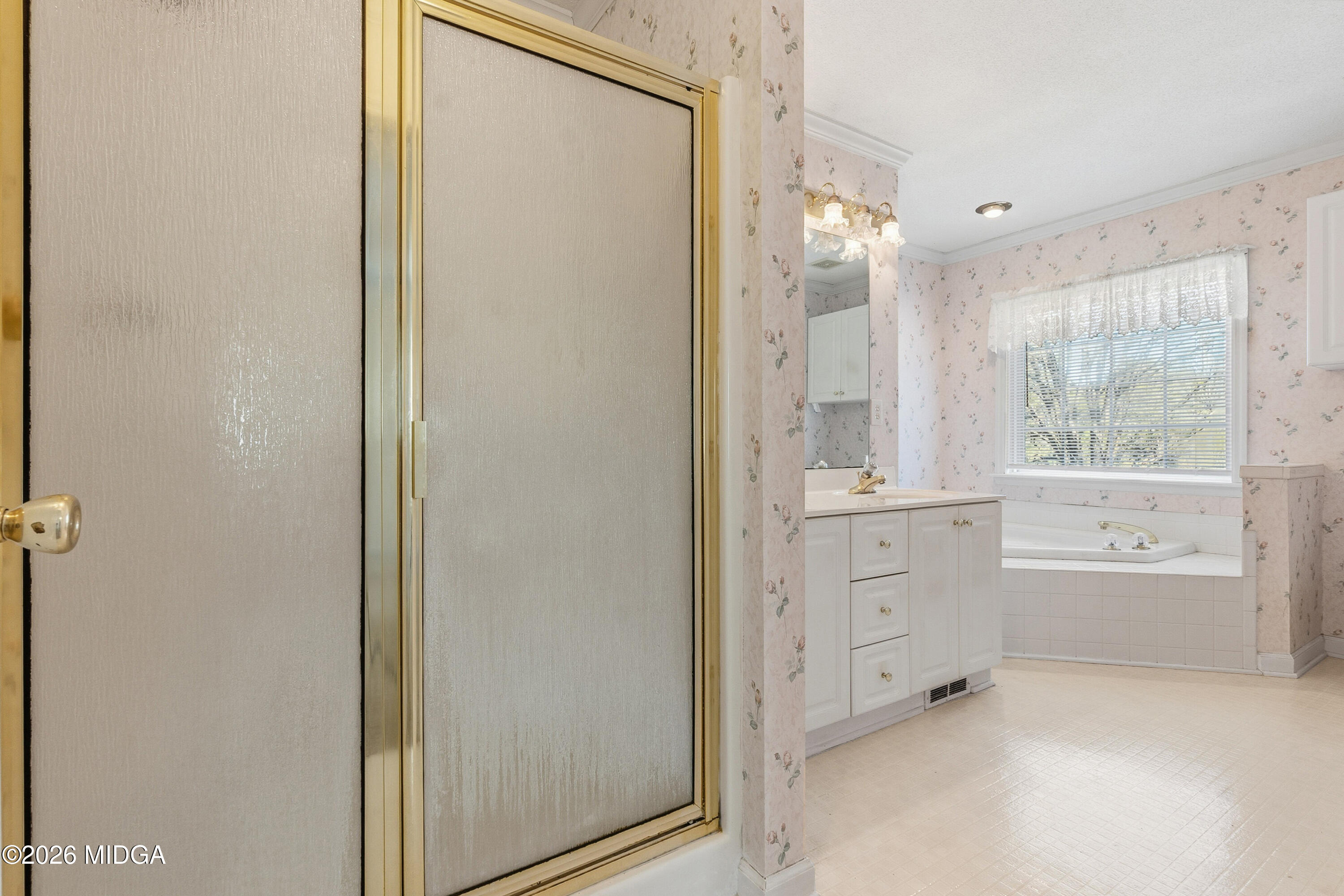 8278 Lower Thomaston Road Macon, GA 31220 - Photo 28 of 59 a bathroom with a granite countertop sink mirror and a bathtub