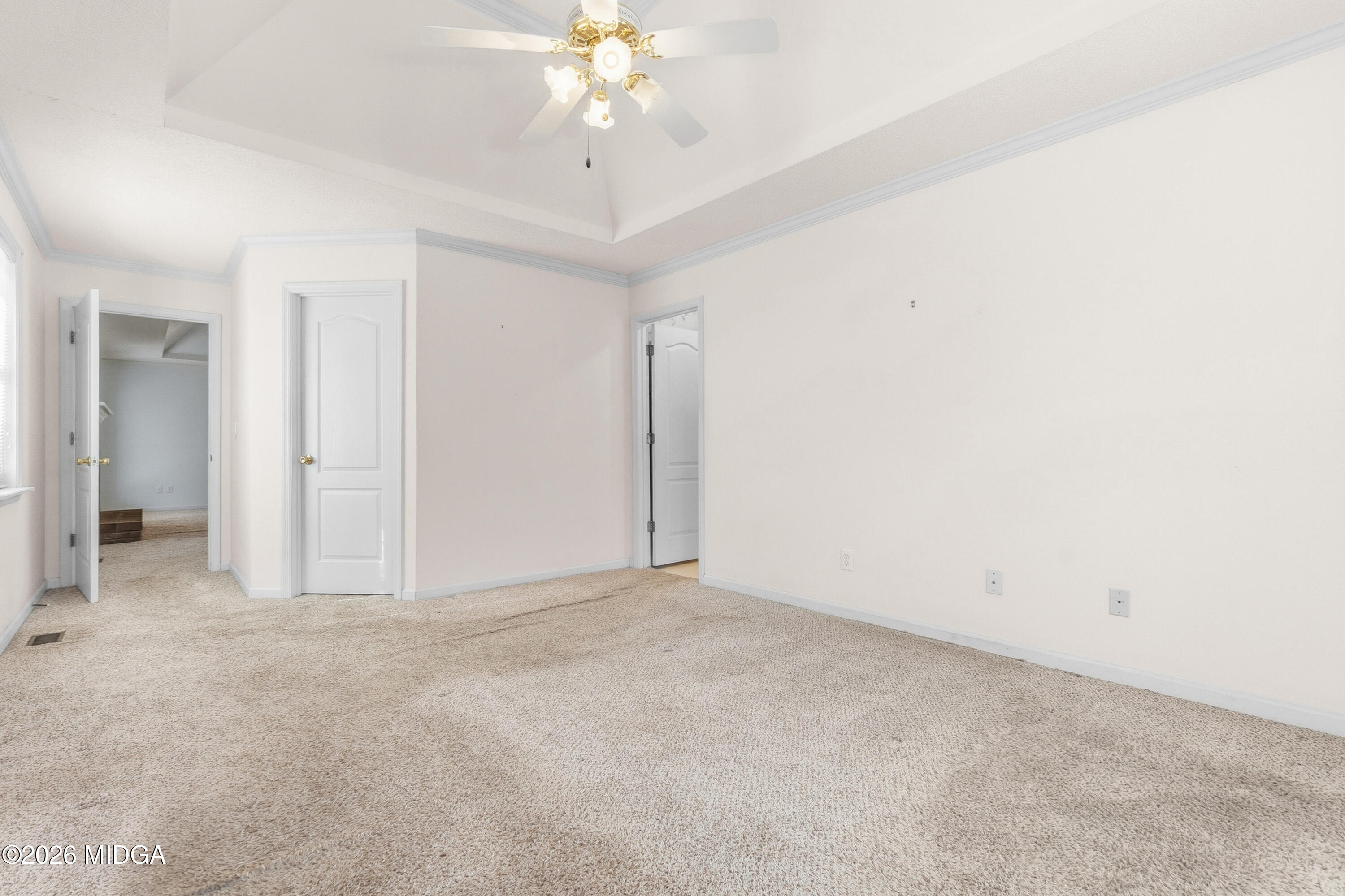 8278 Lower Thomaston Road Macon, GA 31220 - Photo 30 of 59 an empty room with a chandelier fan and windows