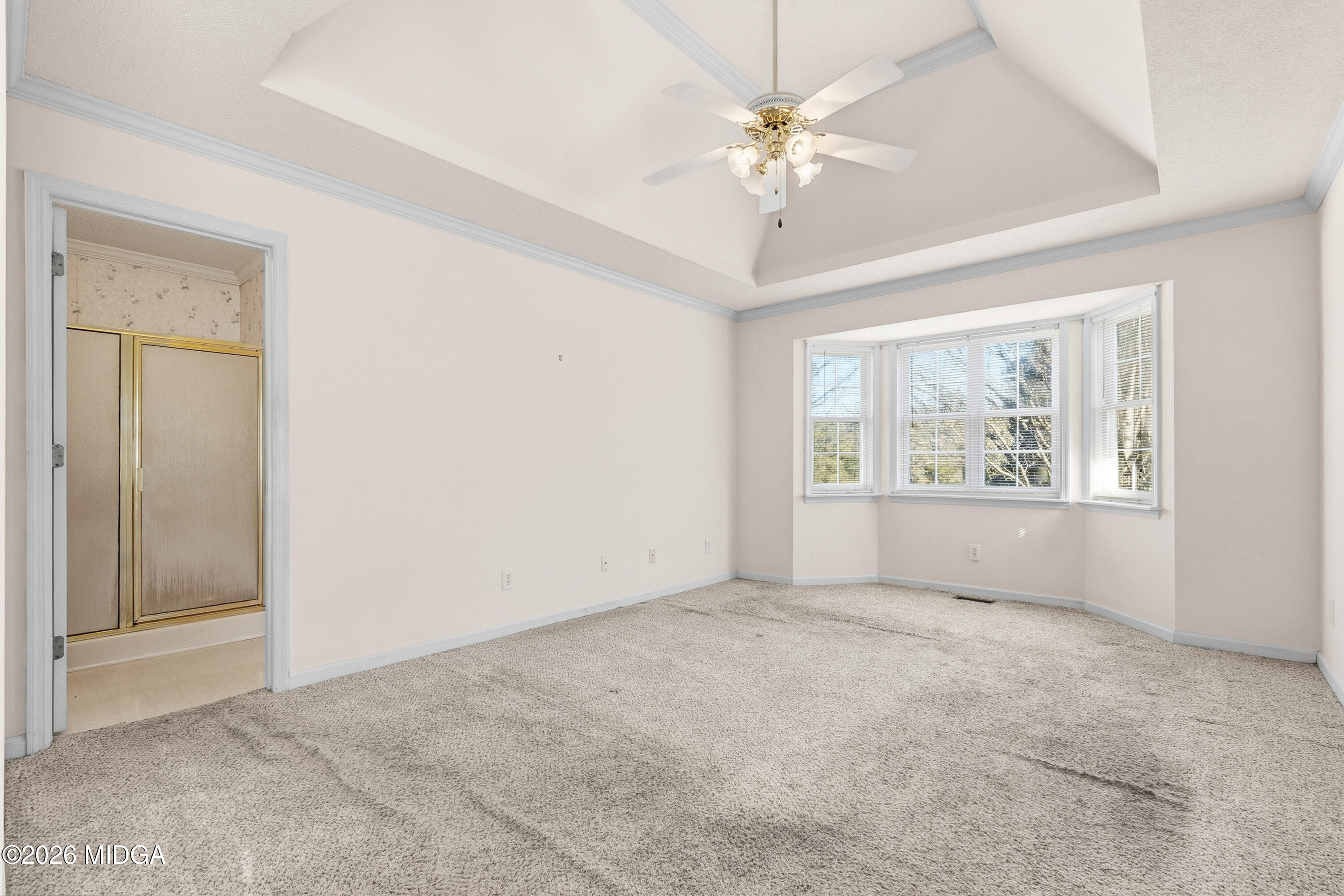 8278 Lower Thomaston Road Macon, GA 31220 - Photo 33 of 59 an empty room with chandelier fan and windows