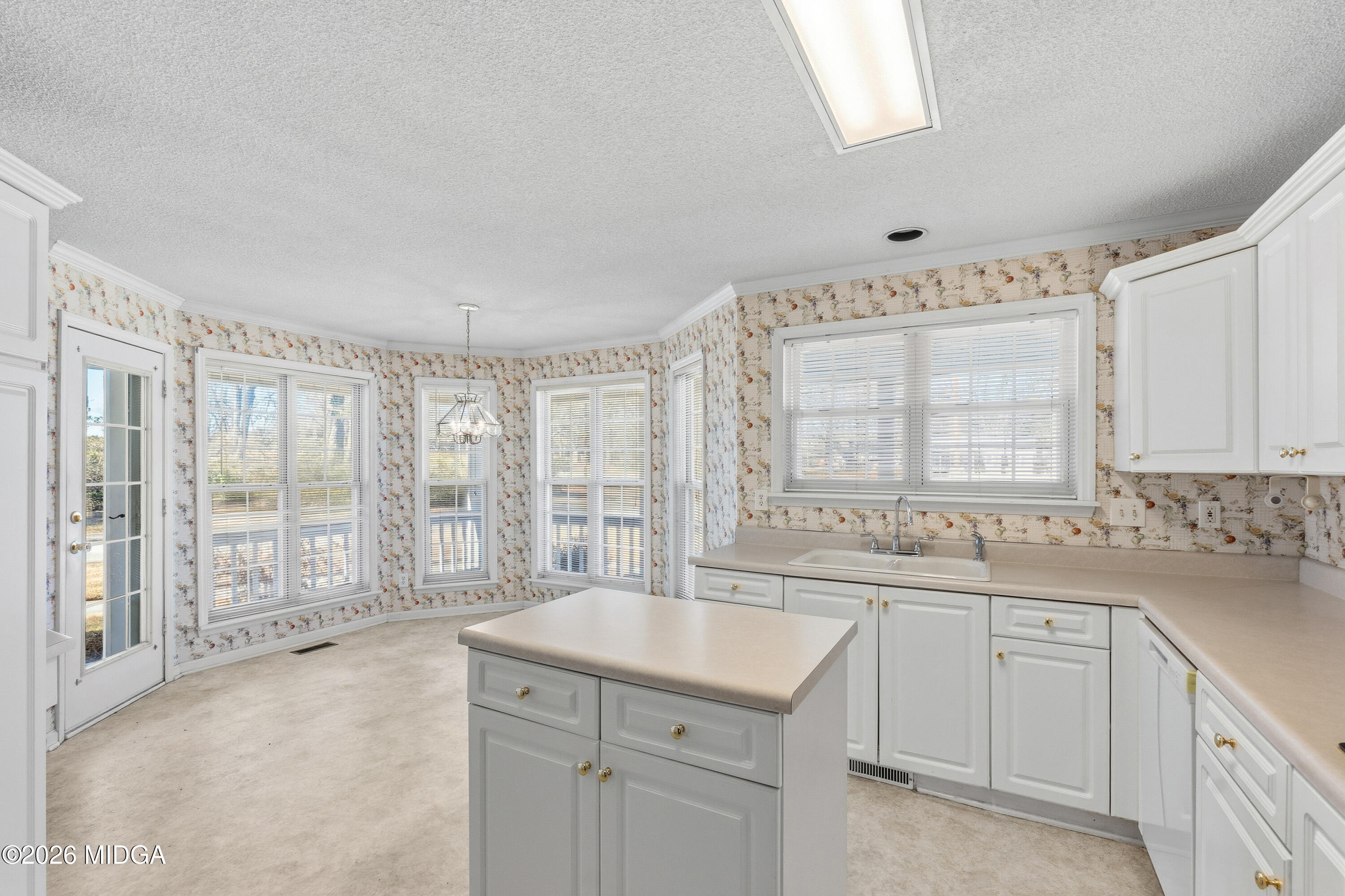 8278 Lower Thomaston Road Macon, GA 31220 - Photo 5 of 59 a large white kitchen with a large window