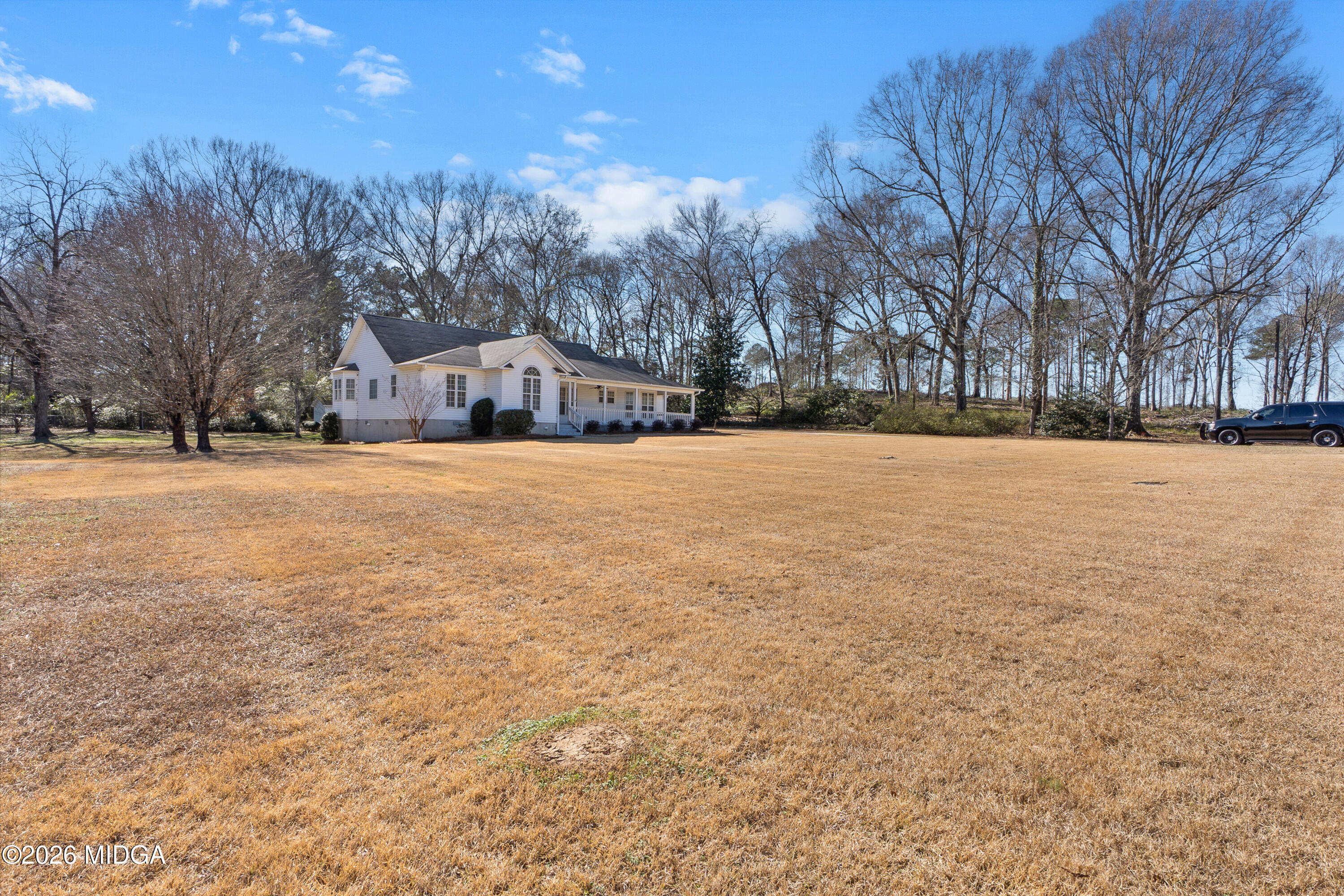 8278 Lower Thomaston Road Macon, GA 31220 - Photo 56 of 59 a large tree with a house in the background