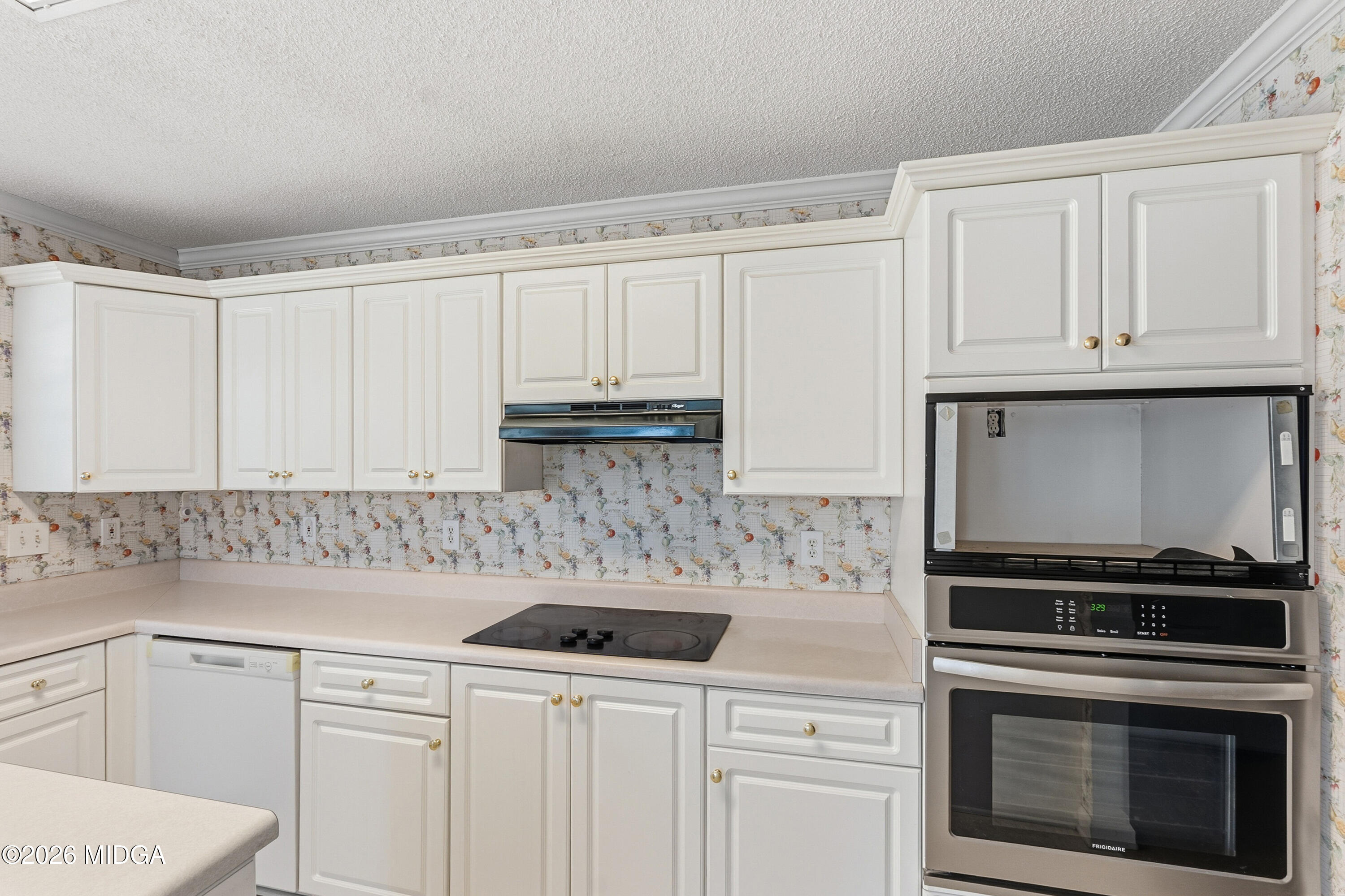 8278 Lower Thomaston Road Macon, GA 31220 - Photo 7 of 59 a kitchen with granite countertop white cabinets and stainless steel appliances
