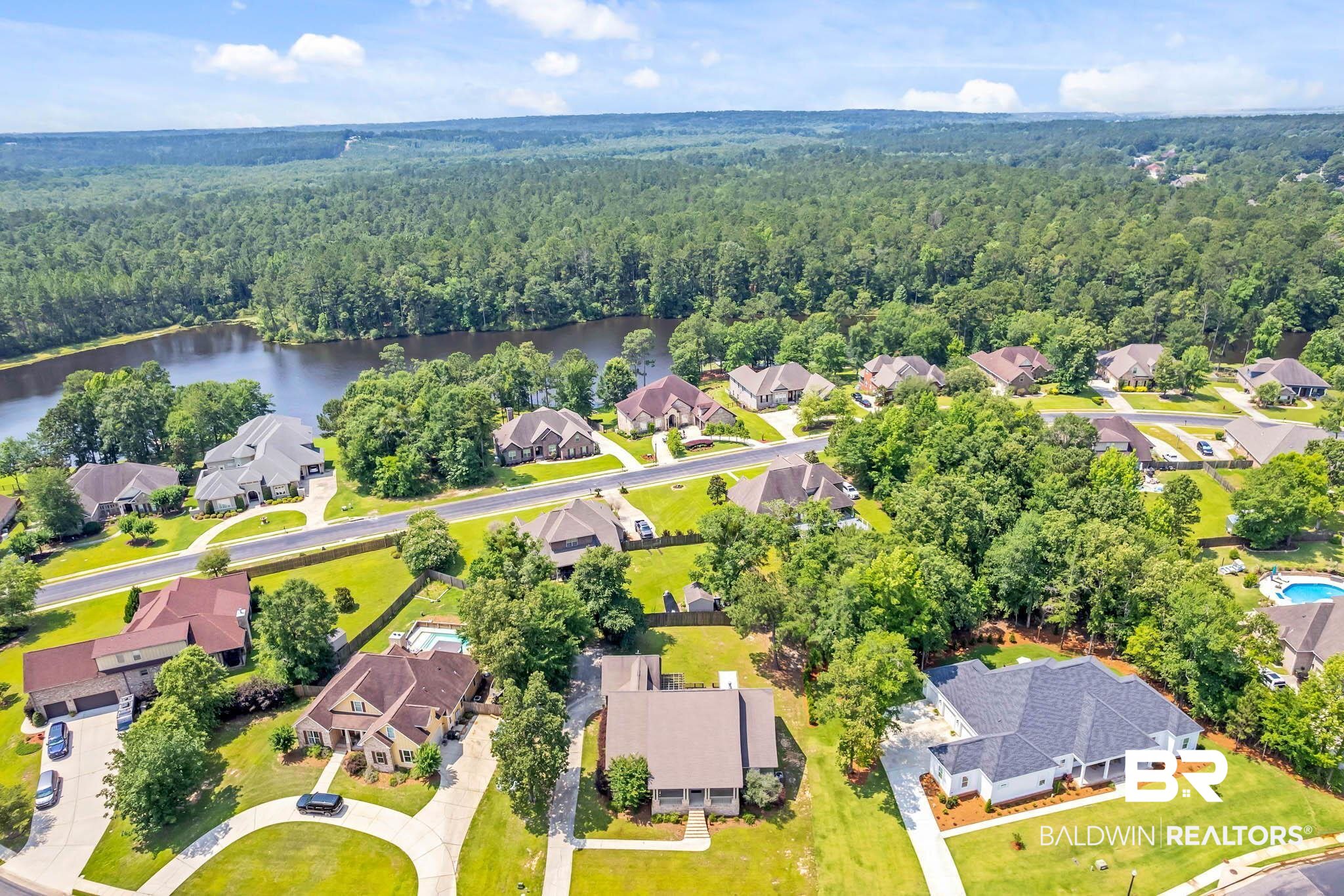 7854 Raegan Lane Daphne, AL 36527 - Photo 67 of 70 Aerial perspective of suburban area featuring a forest and a nearby body of water
