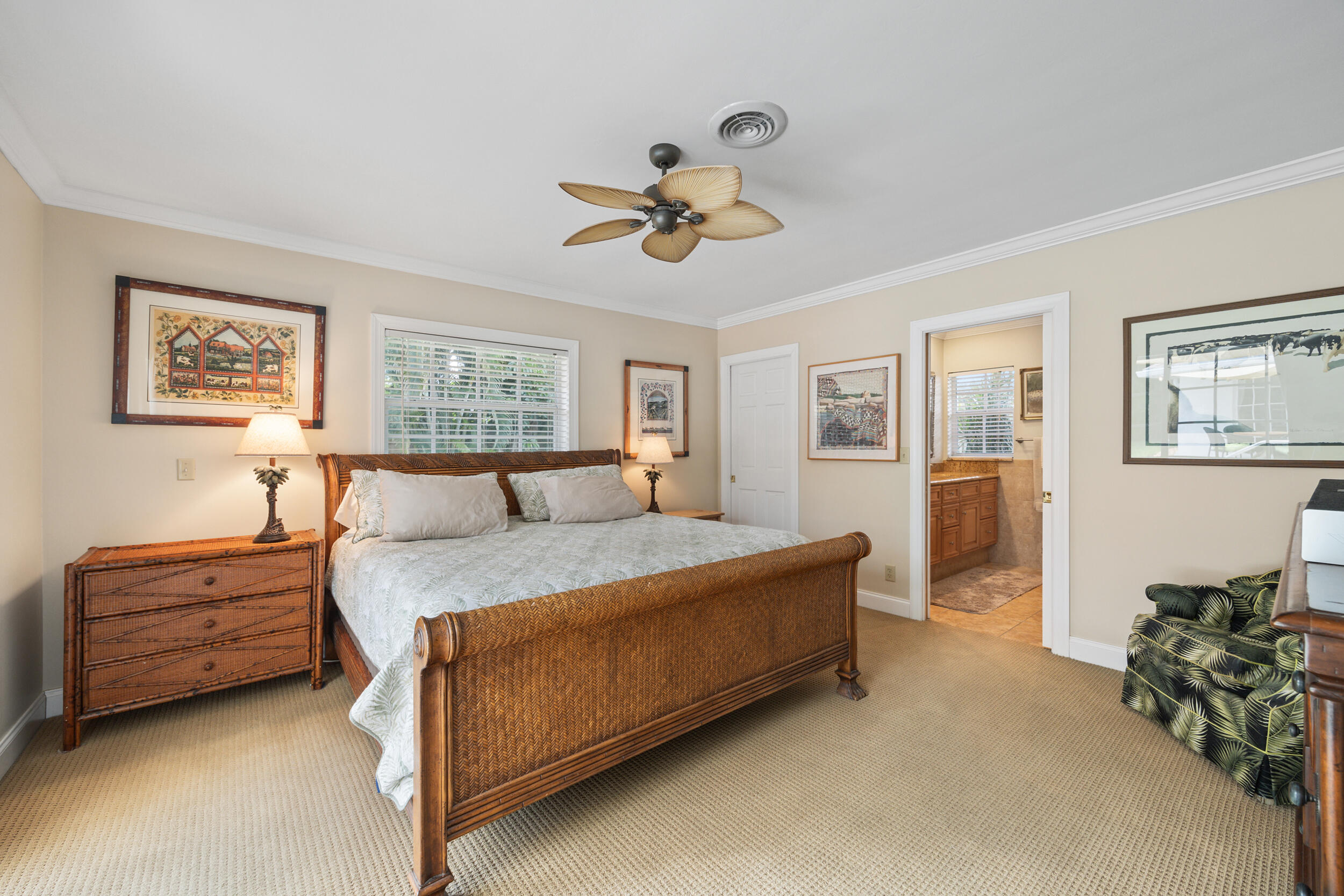 104 Fairview West Tequesta, FL 33469 - Photo 17 of 32 a bedroom with a bed dresser and window