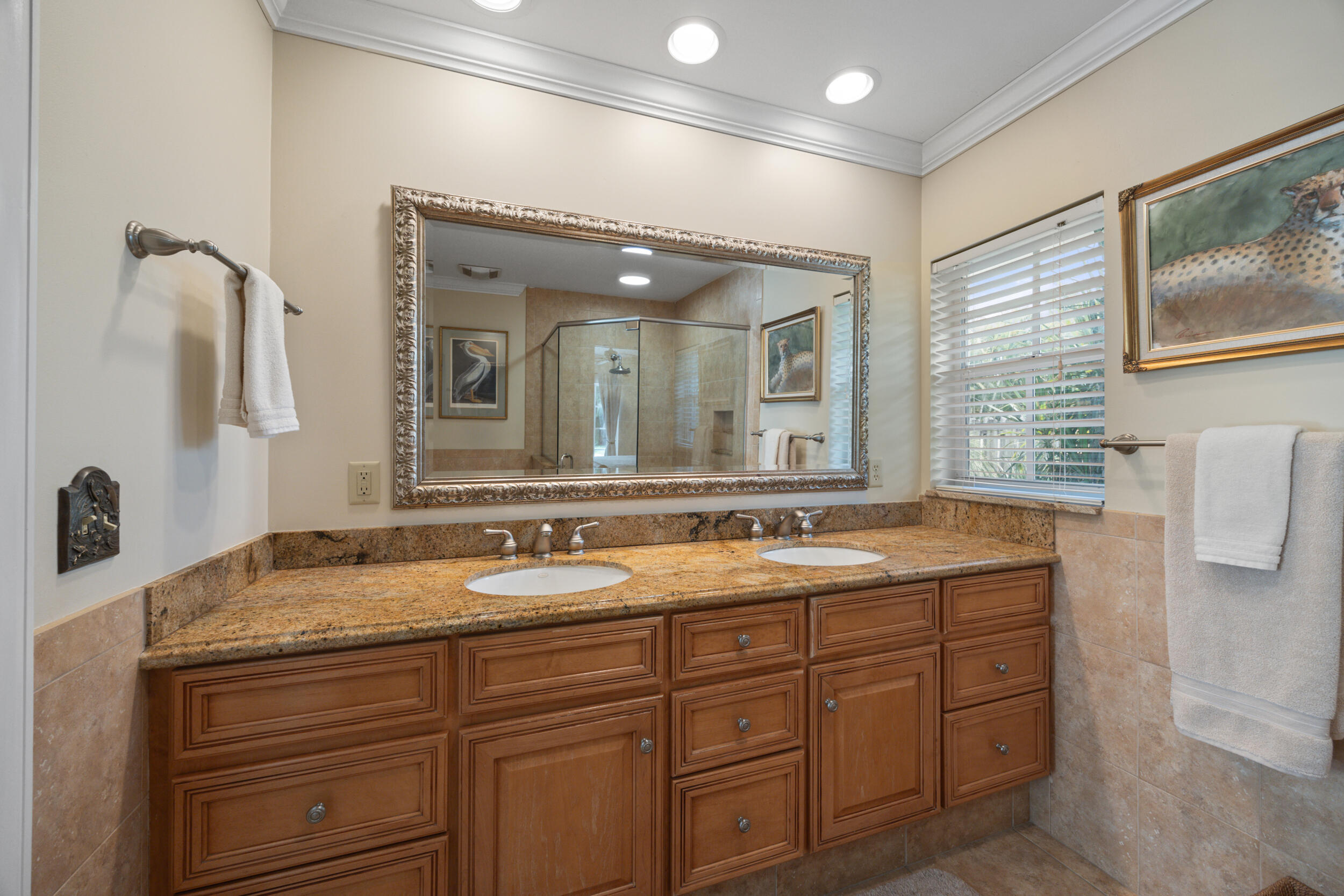 104 Fairview West Tequesta, FL 33469 - Photo 21 of 32 a bathroom with a granite countertop sink mirror and double