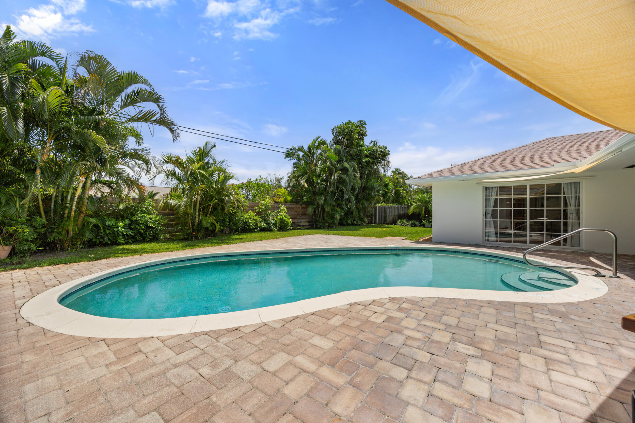 104 Fairview West Tequesta, FL 33469 - Photo 28 of 32 a view of pool with a yard