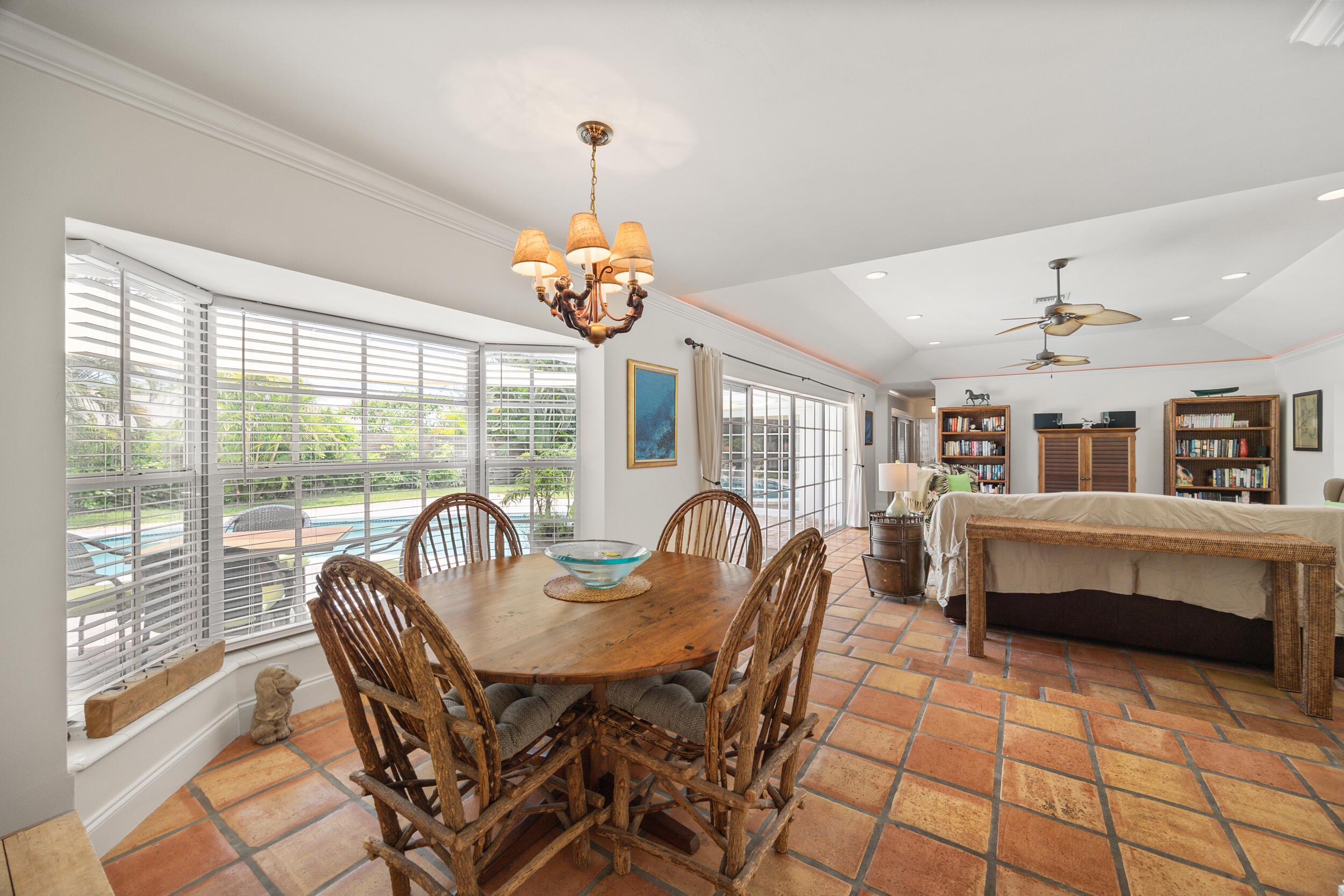 104 Fairview West Tequesta, FL 33469 - Photo 7 of 32 a dining room with furniture a chandelier and window