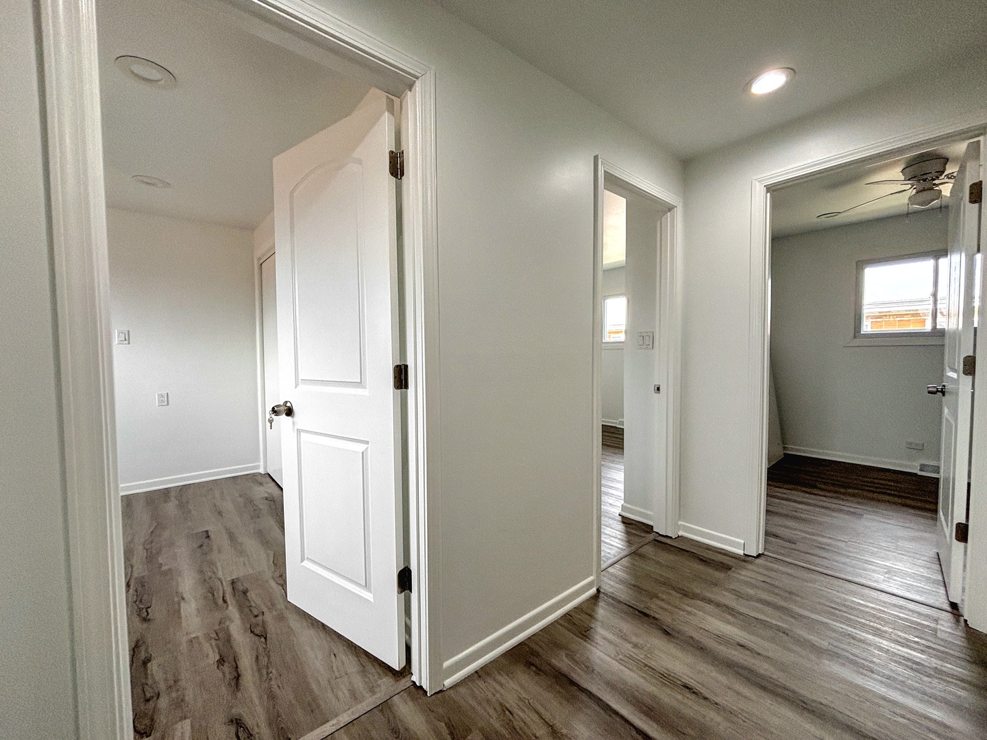 8664 Gregory Lane, Unit E Des Plaines, IL 60016 - Photo 6 of 15 wooden floor and windows in a hall with an entryway