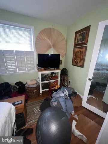 a workspace with furniture and a flat screen tv