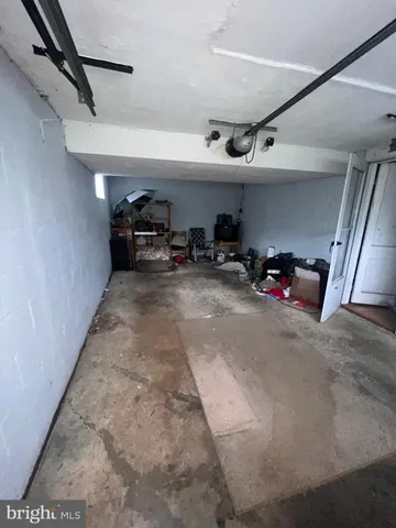 a view of parking garage with cars