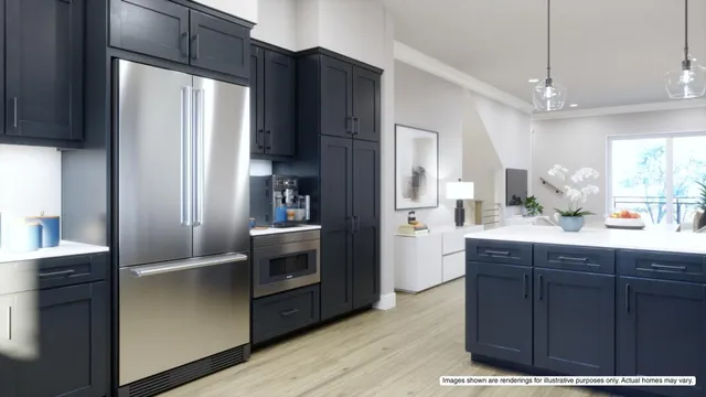 a kitchen with a refrigerator sink and cabinets